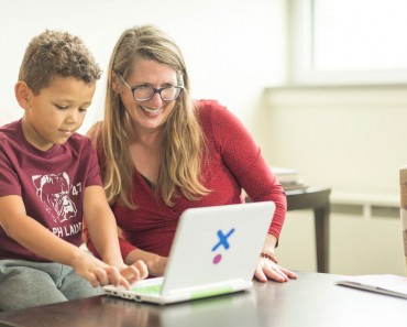 Mom helping son with school work Port St. Lucie